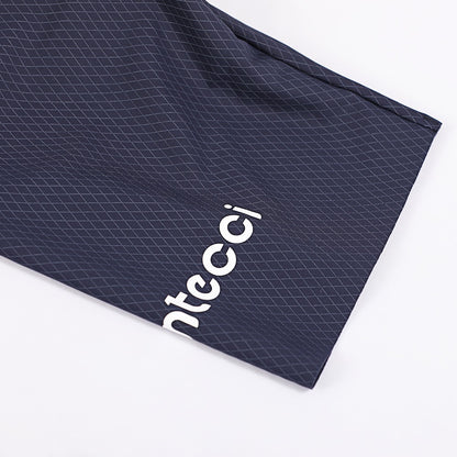 Montecci logo on a navy blue textured fabric background