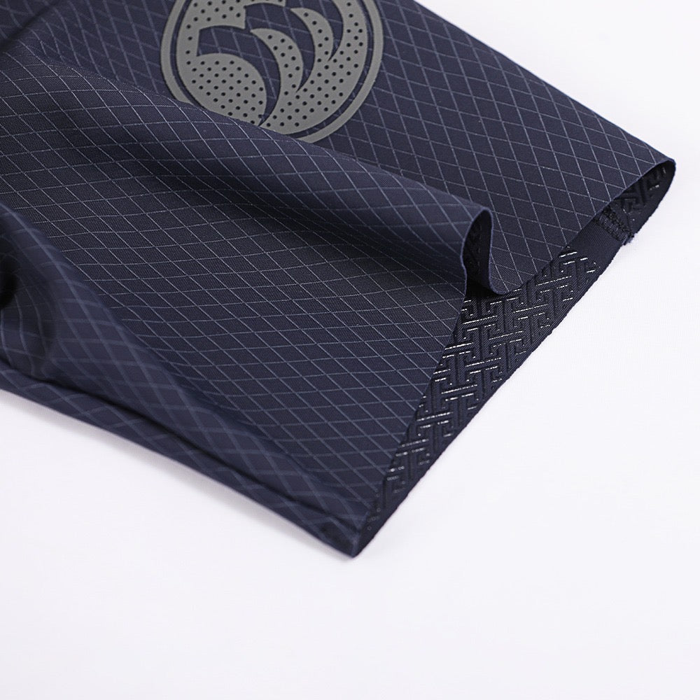Navy blue fabric with a textured pattern and logo on a white background